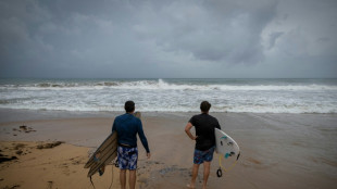 Downgraded Hurricane Erin lashes Caribbean with rain