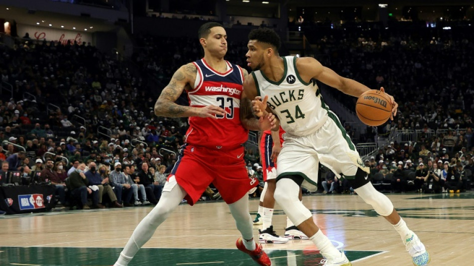 Giannis' triple double helps topple struggling Wizards