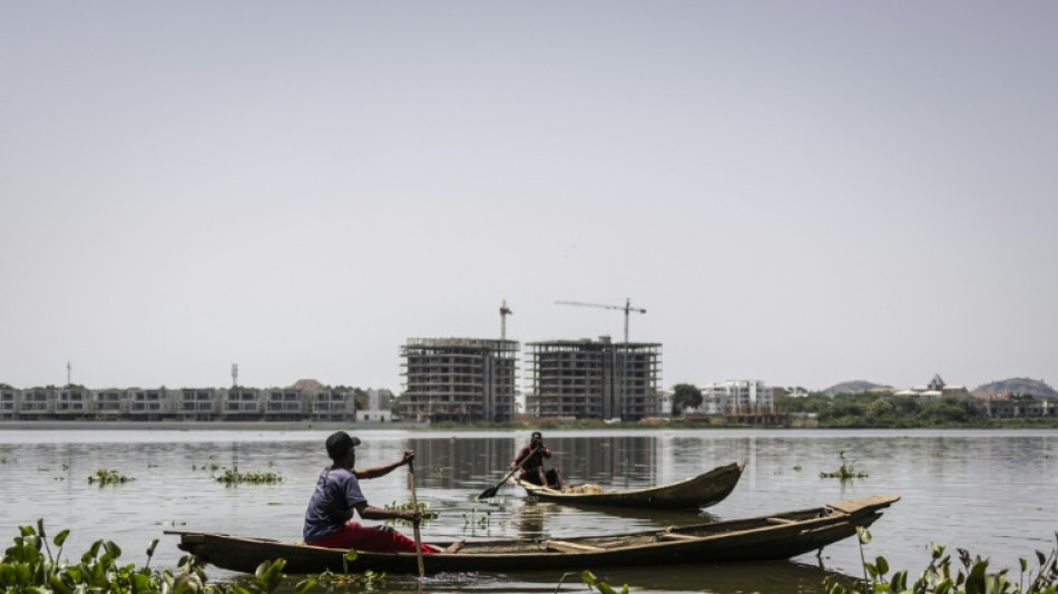 Squeezed by urban growth, Nigerian fishermen stick to tradition