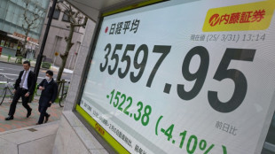 Japan's Nikkei leads hefty equity market losses; gold hits record