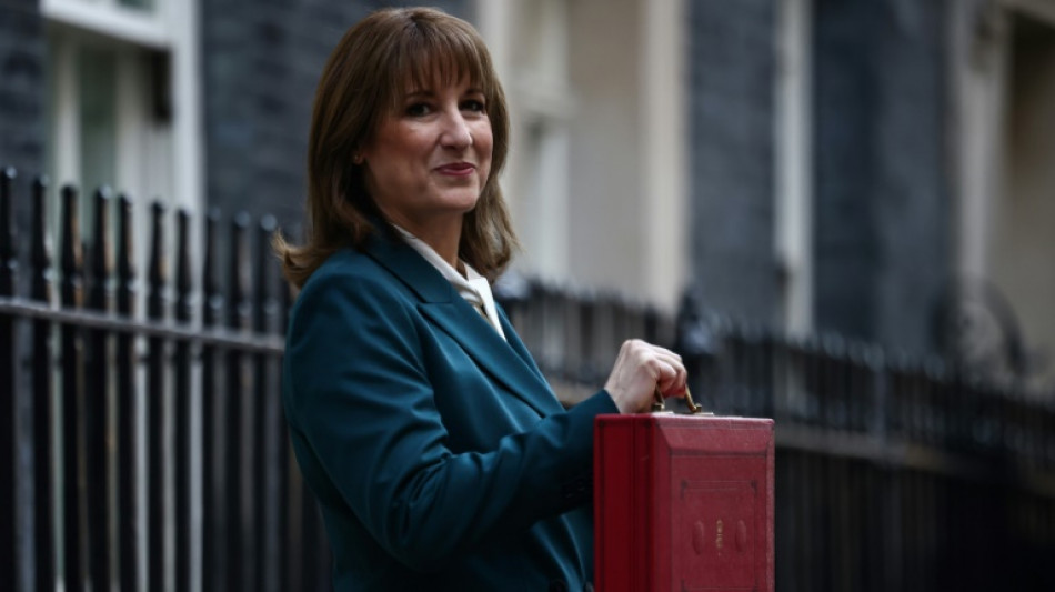 UK unveils tax-raising budget as growth downgraded