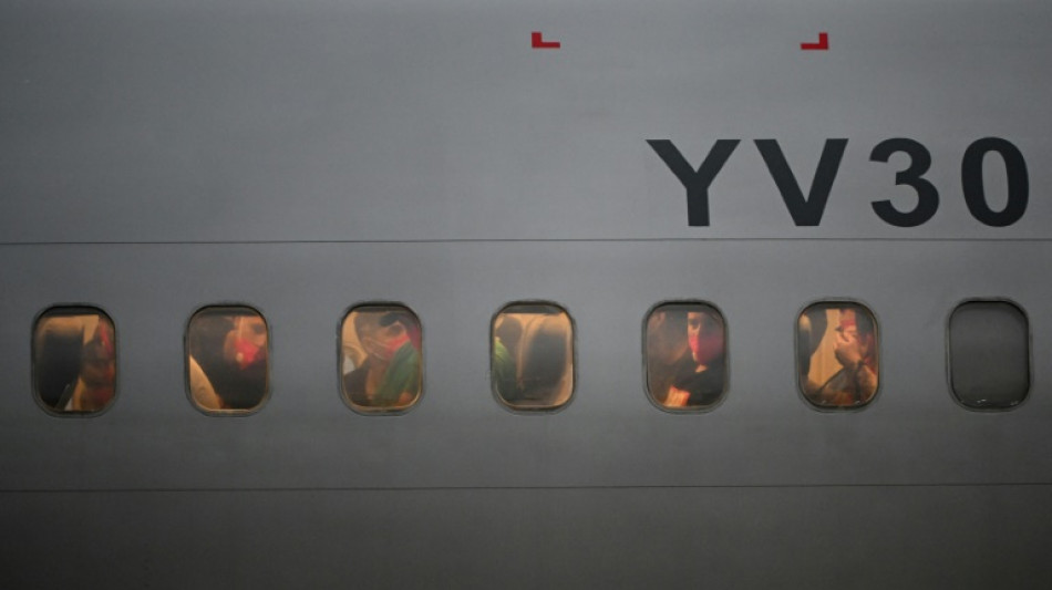 Migrants freed from El Salvador reach Venezuela in US prisoner deal