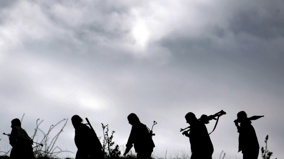 Kurdish PKK fighters destroy weapons at key ceremony