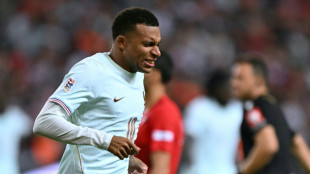 Mbappe scores but suffers knee injury as Zidane gets debut France win