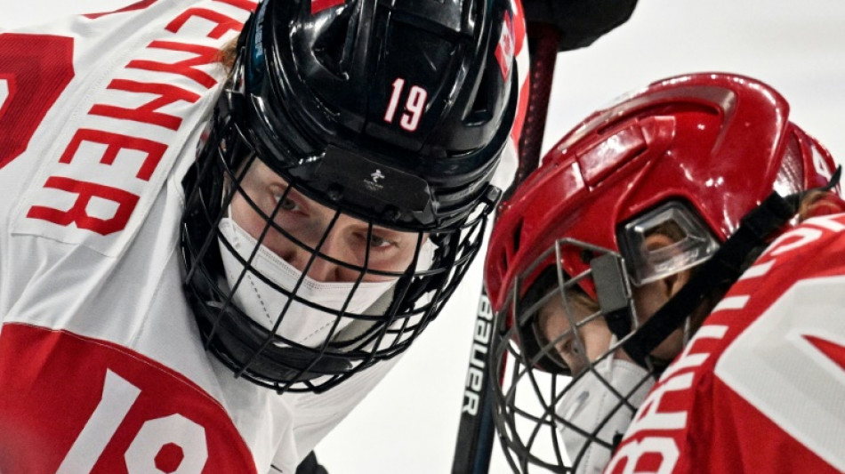 Beijing Olympic hockey players wear Covid face masks during match