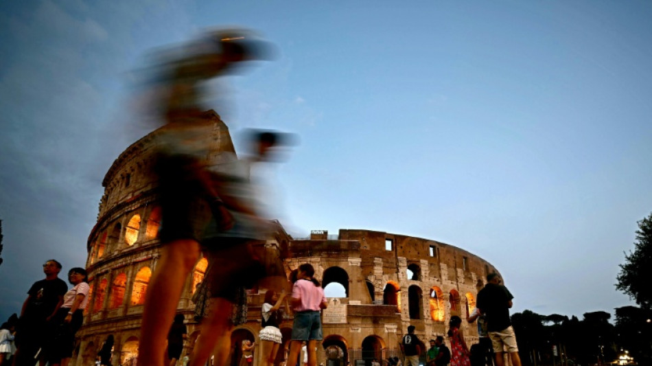 Fleeing the heat, tourists explore Rome at night, underground