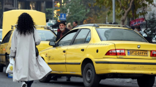 Iran police disperse pro-hijab protesters outside parliament